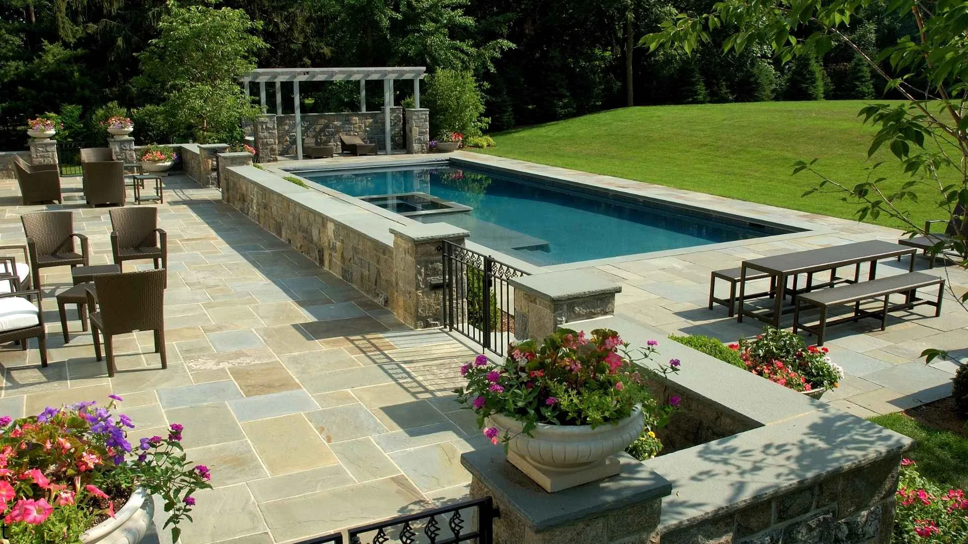 How Backyard Pools, Pergolas, and Outdoor Kitchens Are Safely Installed