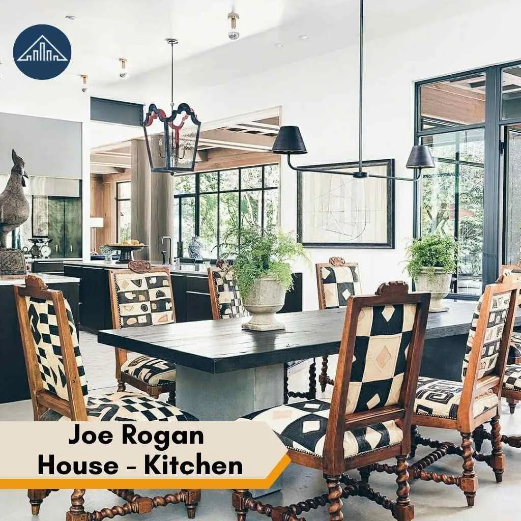 Modern dining area in the Joe Rogan House featuring checkered chairs and a dark wooden table.