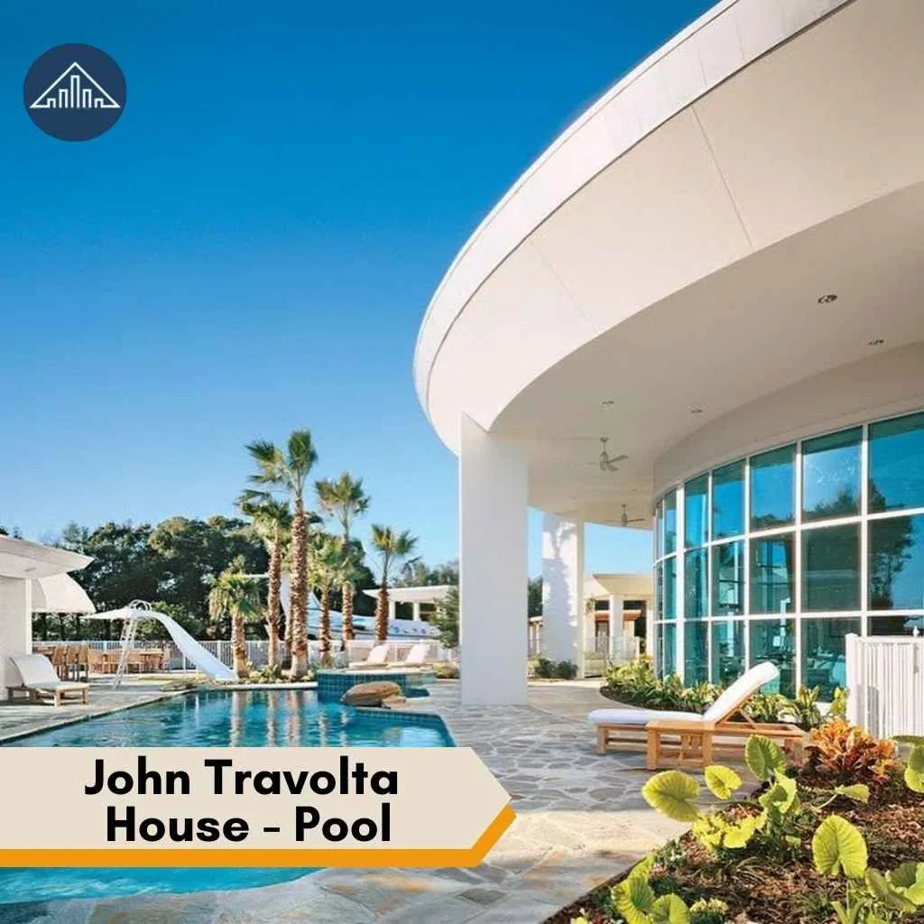 A luxurious pool area with palm trees and modern architecture at the stunning John Travolta house.