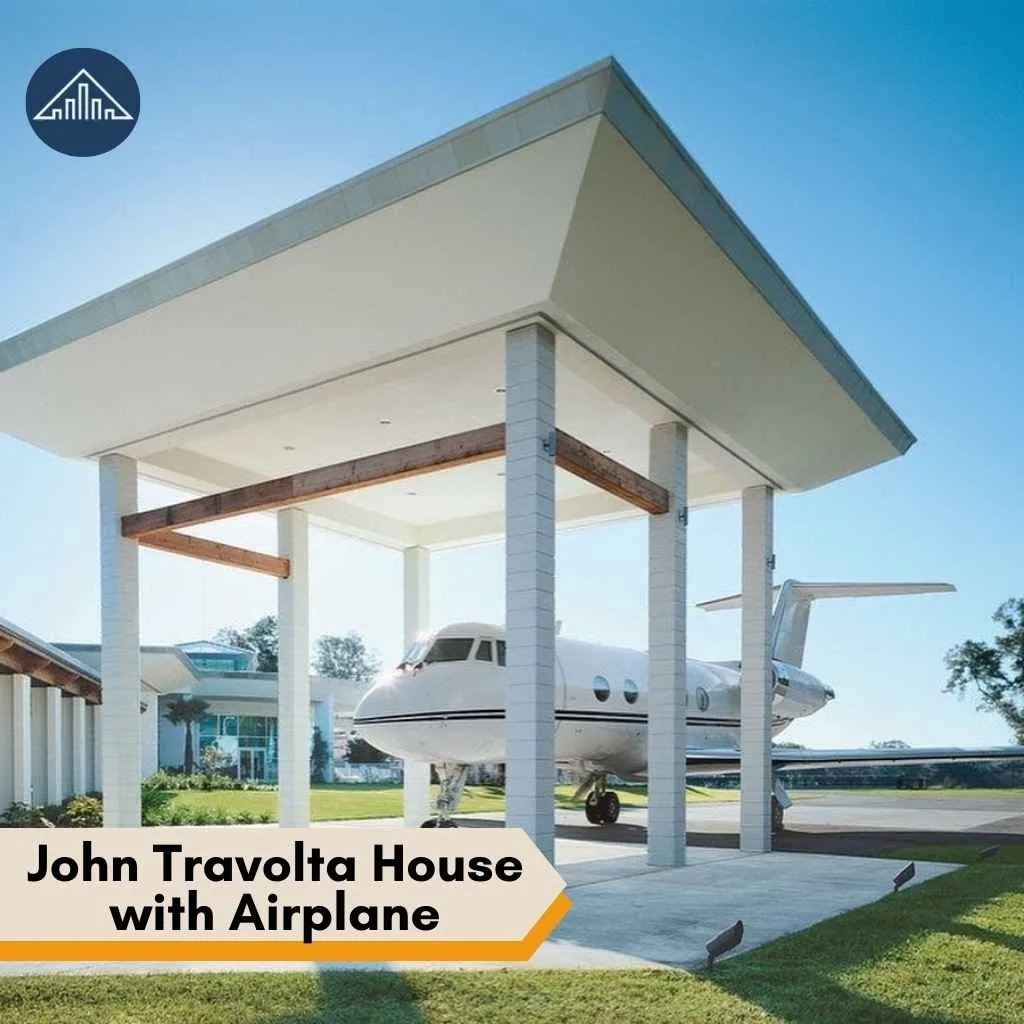 A private jet parked under a massive modern pavilion structure at the unique John Travolta house.
