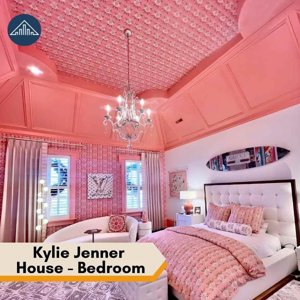 A vibrant pink bedroom inside the Kylie Jenner House featuring patterned walls and a designer surfboard.