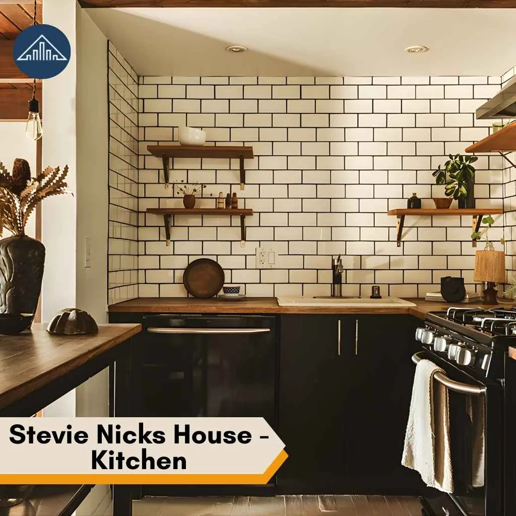 A white subway tile backsplash and dark cabinets create a modern kitchen look at Stevie Nicks House.