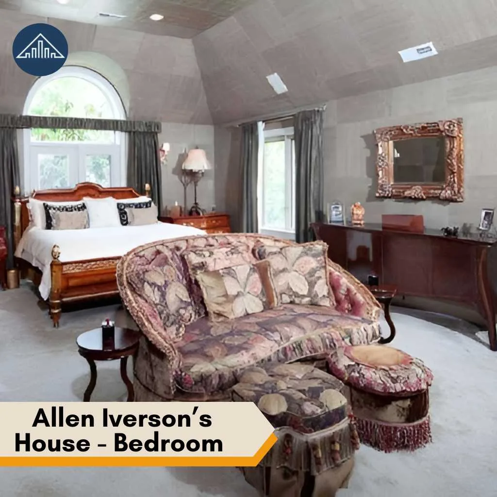 A spacious bedroom inside the Allen Iverson house featuring a large bed and floral patterned seating.
