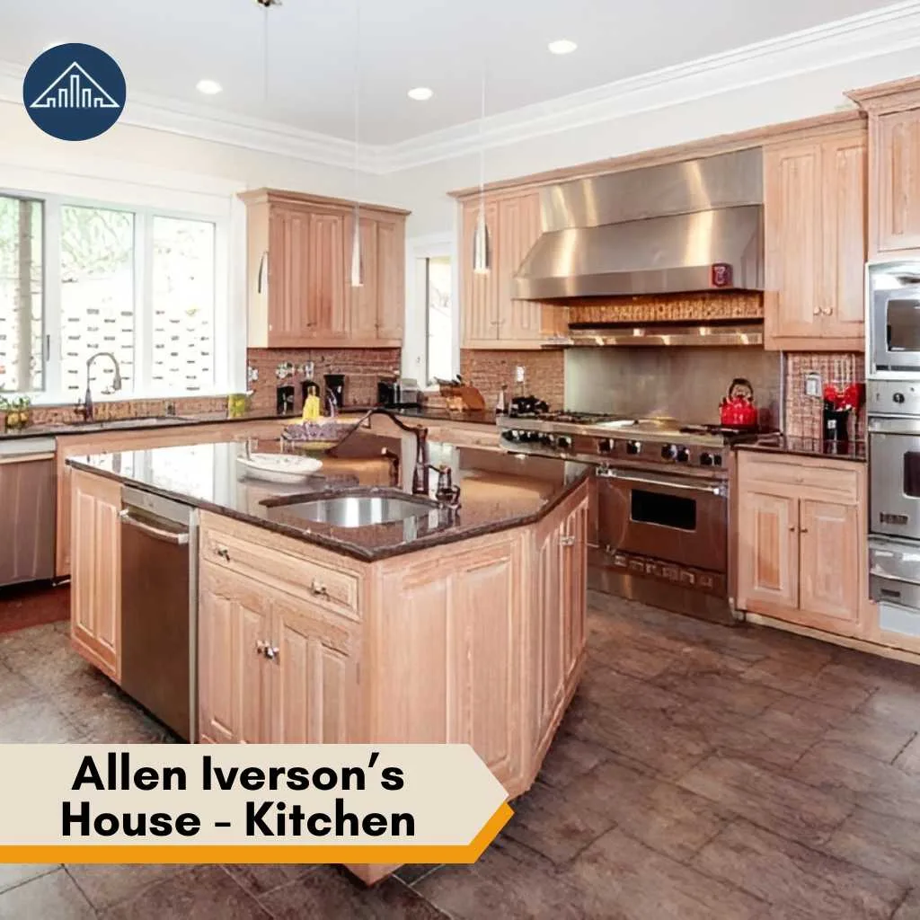 Modern kitchen area inside the Allen Iverson house featuring light wood cabinets and professional-grade appliances.