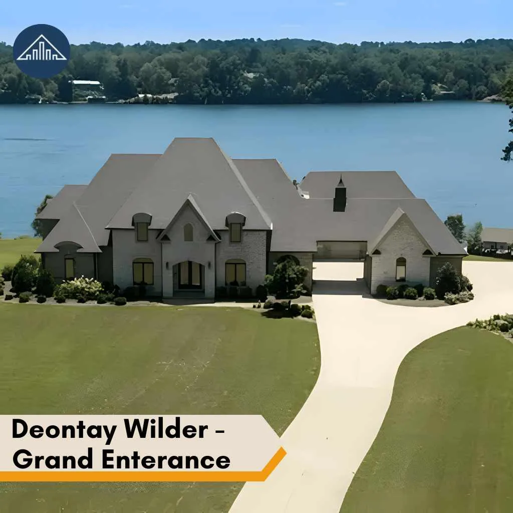 The exterior of the deontay wilder house showcasing a grand entrance beside a beautiful waterfront.