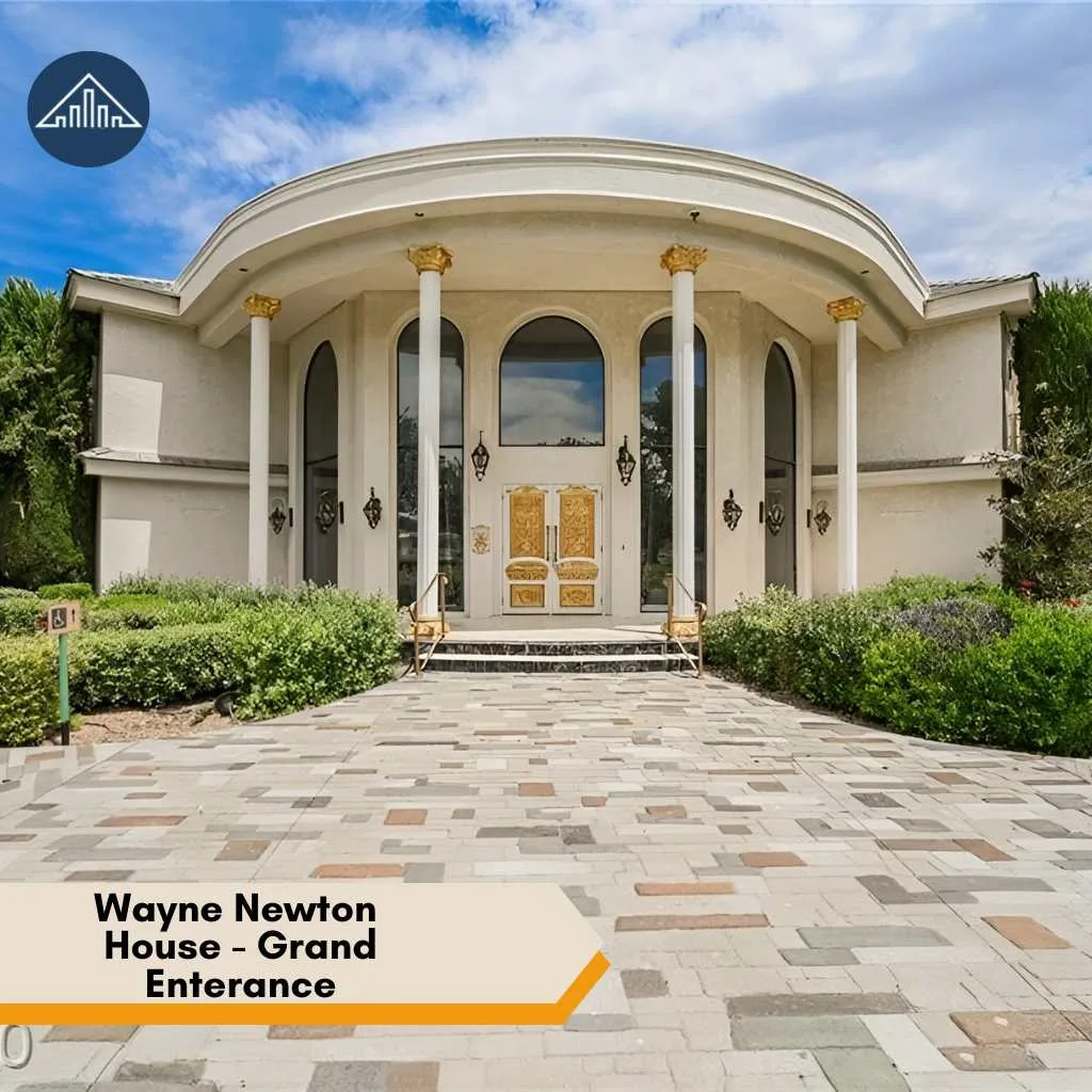 Wayne Newton House: Inside Casa de Shenandoah Estate 2026 3 A grand stone walkway leads to the ornate gold doors and tall columns of Wayne Newton House.